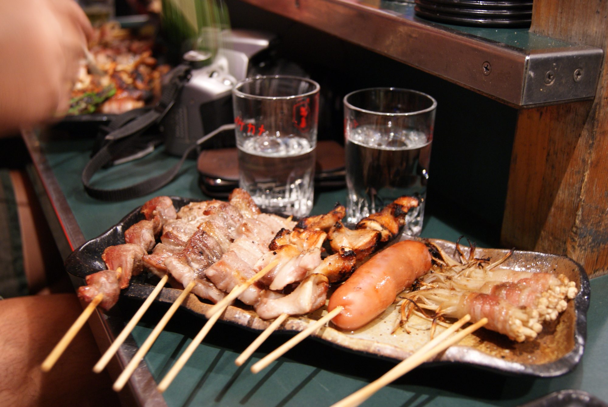 Skewers cooking at a Fukuoka yatai stall