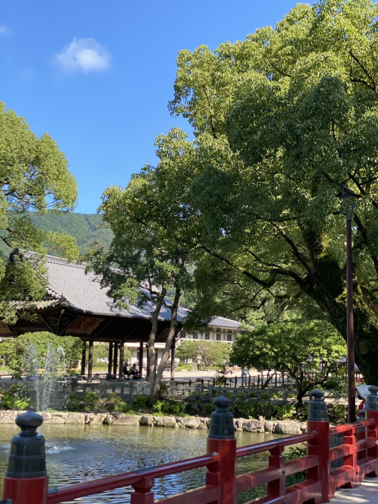 A vermilion arched bridge over Shinji Pond in the grounds of Dazaifu Tenmangu
